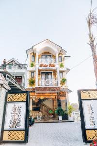a building with two signs in front of it at Dalat Mist House - Đà Lạt in Da Lat