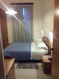 Posteľ alebo postele v izbe v ubytovaní Hotel Acapulco
