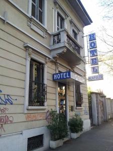 a hotel building with a sign on the side of it at Hotel Acapulco in Milan