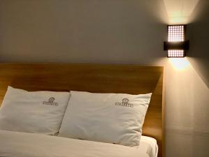 Uma cama ou camas num quarto em Stay Pohang Hotel