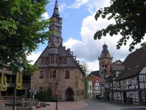 an old building with two towers on a street at Ferienwohnung "Vier Pfoten" in Korbach in Korbach