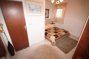 Posteľ alebo postele v izbe v ubytovaní Small Apartment For A Great Holiday