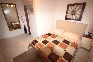 Posteľ alebo postele v izbe v ubytovaní Small Apartment For A Great Holiday