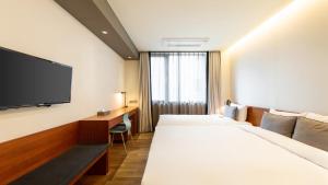 Letto o letti in una camera di Seoul Hotel ShinShin Myeongdong