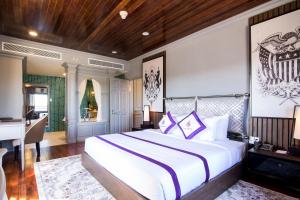 מיטה או מיטות בחדר ב-TTC Hotel - Ngoc Lan