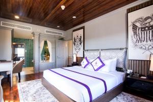 Postel nebo postele na pokoji v ubytování TTC Hotel - Ngoc Lan