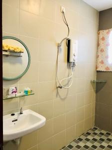 a bathroom with a shower and a sink at Art Heritage at Lucky 7 in Ipoh