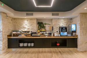 a kitchen with a counter in a room at Artion Boutique by Enorme in Heraklio Town