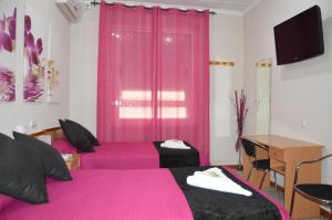 TV a/nebo společenská místnost v ubytování Hostal Carrizo