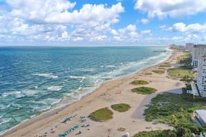 an aerial view of a beach and the ocean at RA suites in Pompano Beach