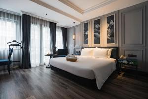 Postel nebo postele na pokoji v ubytování Solaria Hanoi Hotel