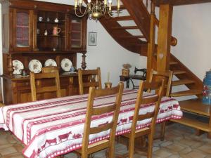 a dining room with a table and two chairs at Les Gentianes in Breitenbach-Haut-Rhin