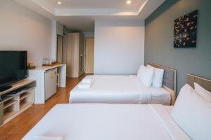 Voodi või voodid majutusasutuse Sukhothai Garden toas