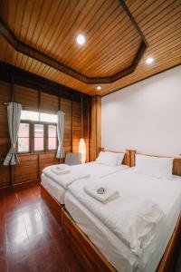 Voodi või voodid majutusasutuse Sukhothai Garden toas