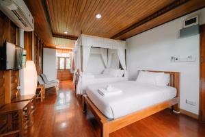 Voodi või voodid majutusasutuse Sukhothai Garden toas