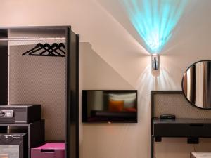 TV/Unterhaltungsangebot in der Unterkunft ArtLoft Garni Hotel