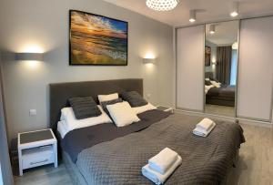 Posteľ alebo postele v izbe v ubytovaní Apartament RELAX