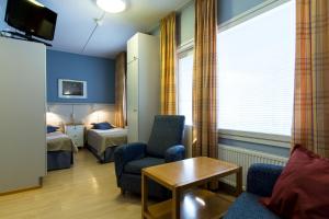 a hotel room with a room with two beds at Spa Hotel Rauhalahti in Kuopio