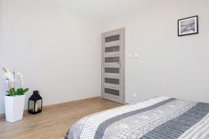 Posteľ alebo postele v izbe v ubytovaní Apartament Bursztyn II Klifowa + 36 fotografií