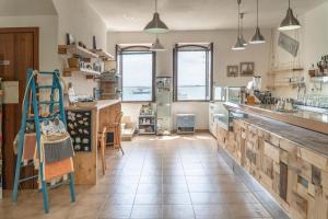 Cucina o angolo cottura di MuMA Hostel
