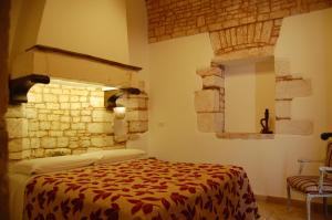 Postel nebo postele na pokoji v ubytování Trulli Soave