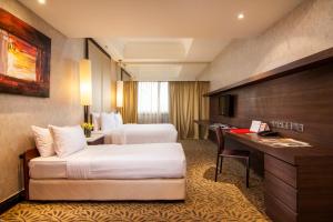 Uma cama ou camas num quarto em Sunway Putra Hotel Kuala Lumpur