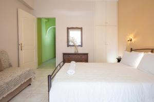 Ένα ή περισσότερα κρεβάτια σε δωμάτιο στο Kerasoula Apartments