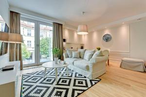 a living room with a couch and a table at Sopot Centrum Apartments in Sopot