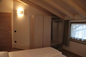 Posteľ alebo postele v izbe v ubytovaní MOUNTAIN RESORT Appartamenti