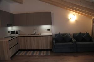 Kuchyňa alebo kuchynka v ubytovaní MOUNTAIN RESORT Appartamenti