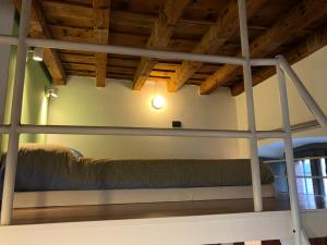 Un ou plusieurs lits dans un hébergement de l'établissement Sage House - Carozzi Apartments
