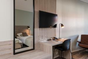 Postel nebo postele na pokoji v ubytování Grand Hotel Egersund