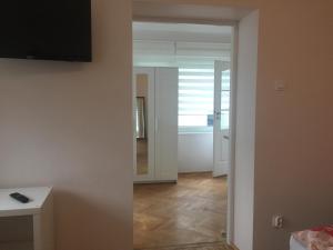 Televízia a/alebo spoločenská miestnosť v ubytovaní Apartamenty Przy Plaży Gdynia Orłowo