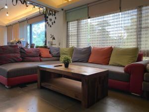 a living room with a couch and a coffee table at Anping wedding House 安平小洋房 包棟Villa in Anping