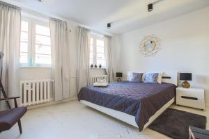 Postel nebo postele na pokoji v ubytování Republika Kopernika Apartment