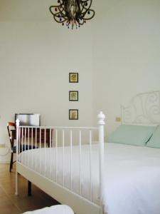 Postel nebo postele na pokoji v ubytování Le stanze di Ninni