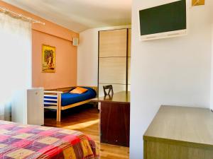 A bed or beds in a room at Maison d'Elite