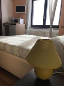 A bed or beds in a room at Maison d'Elite