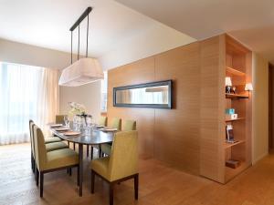 a dining room with a table and chairs at Lanson Place Bukit Ceylon in Kuala Lumpur