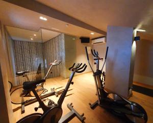 a gym with two exercise bikes in a room at Hotel Villa Real in Madrid
