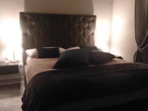 Кровать или кровати в номере Compasso Suites