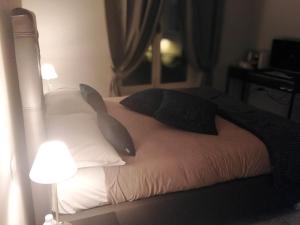 Ένα ή περισσότερα κρεβάτια σε δωμάτιο στο Compasso Suites