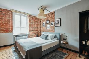 Posteľ alebo postele v izbe v ubytovaní ARTHOTEL STALOWA 52