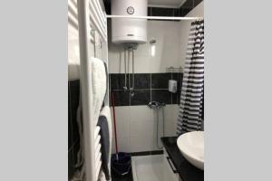 Koupelna v ubytování Apartments Balkanska City Center + 31 fotografií