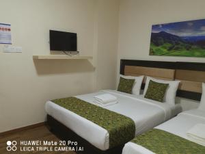 Postel nebo postele na pokoji v ubytování Yeob Bay hotel Ampang