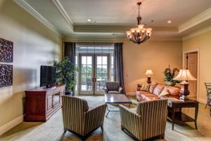 a living room with a couch and a table at Cottages and Suites at River Landing in Wallace