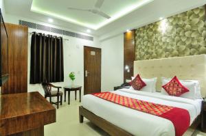 Postel nebo postele na pokoji v ubytování Hotel Yuvraj Deluxe + 37 fotografií