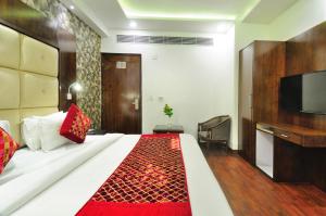 Postel nebo postele na pokoji v ubytování Hotel Yuvraj Deluxe