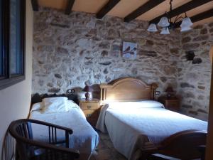 Ένα ή περισσότερα κρεβάτια σε δωμάτιο στο Rural Montesa