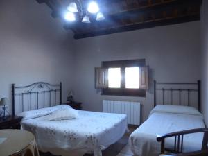 Posteľ alebo postele v izbe v ubytovaní Rural Montesa